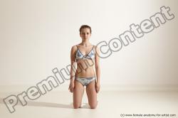 Swimsuit Gymnastic poses Woman White Moving poses Slim long brown Dynamic poses Academic
